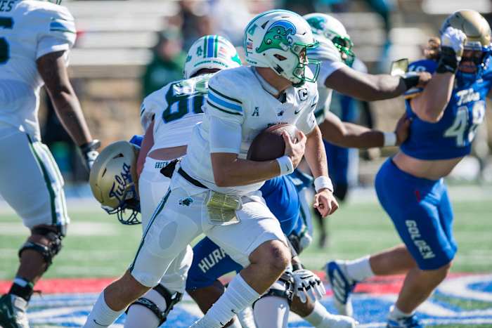 Tulsa, Oklahoma, USA; Tulane Green Wave quarterback Michael Pratt (7) runs the ball during the third quarter against the Tulsa Golden Hurricane at Skelly Field at H.A. Chapman Stadium. Tulane won 27-13.